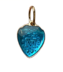 Miraculous medal in the shape of a golden heart