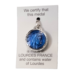 Virgin medal in profile, aluminum, round 17.5 mm, enameled and faceted, containing Lourdes water